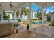 Inviting backyard featuring a pool, spa, patio, and lush landscaping at 1131 Fern Ave, Orlando, FL 32814
