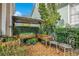 Outdoor space featuring raised garden beds, gravel, and decorative seating at 1131 Fern Ave, Orlando, FL 32814