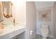 Powder room with marble countertop, vessel sink, and gold accents at 1131 Fern Ave, Orlando, FL 32814