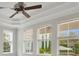 Bedroom with trey ceiling and windows offering outdoor views at 1131 Fern Ave, Orlando, FL 32814