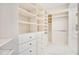 Spacious walk-in closet with custom white shelving, drawers, and ample storage space at 1131 Fern Ave, Orlando, FL 32814