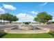 Beautiful fountain in a well-manicured community space with a view of the lake at 1131 Fern Ave, Orlando, FL 32814