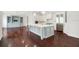 Spacious open concept kitchen with a large island, stainless steel appliances, and white cabinets at 1131 Fern Ave, Orlando, FL 32814