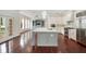 Spacious kitchen with large island, stainless appliances, and sleek white cabinetry at 1131 Fern Ave, Orlando, FL 32814