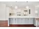Spacious kitchen with a large island, stainless steel appliances, and modern finishes at 1131 Fern Ave, Orlando, FL 32814