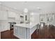 Open kitchen with island, stainless appliances, and views to the entertainment area at 1131 Fern Ave, Orlando, FL 32814