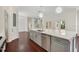 Kitchen island featuring white countertop, gray cabinets, and stainless steel appliances at 1131 Fern Ave, Orlando, FL 32814