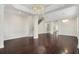 Bright living room features a staircase, wine cellar, hardwood floors, and a stylish chandelier at 1131 Fern Ave, Orlando, FL 32814