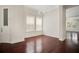 Bright living room featuring hardwood floors, modern lighting, and large windows for natural light at 1131 Fern Ave, Orlando, FL 32814
