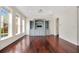Bright living room with hardwood floors, entertainment center and lots of natural light at 1131 Fern Ave, Orlando, FL 32814