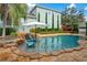 Stunning swimming pool area featuring spa and lounge chairs at 1131 Fern Ave, Orlando, FL 32814