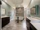 Elegant bathroom with soaking tub, double vanity, and heated towel racks at 1424 Richmond Grand Ave, Orlando, FL 32820