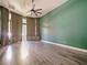 Spacious bedroom with wood-look floors and neutral walls at 1424 Richmond Grand Ave, Orlando, FL 32820