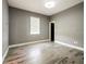 Spacious bedroom with wood-look floors and neutral walls at 1424 Richmond Grand Ave, Orlando, FL 32820