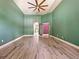 Bright bedroom with wood-look floors and access to bathroom at 1424 Richmond Grand Ave, Orlando, FL 32820