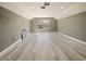 Large bonus room with wood-look floors and window at 1424 Richmond Grand Ave, Orlando, FL 32820