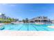 View of the community pool with lap lanes and a spacious deck at 1424 Richmond Grand Ave, Orlando, FL 32820
