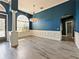 Dining room with hardwood floors, white wainscoting and blue walls at 1424 Richmond Grand Ave, Orlando, FL 32820