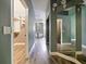 Long hallway with wood-look floors and access to closet and bathroom at 1424 Richmond Grand Ave, Orlando, FL 32820