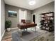Bright home office features built-in shelving and wood desk at 1424 Richmond Grand Ave, Orlando, FL 32820