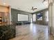 Open concept home theater with projector, large screen, and hardwood floors at 1424 Richmond Grand Ave, Orlando, FL 32820