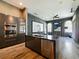 Modern kitchen with island, stainless steel appliances, and granite countertops at 1424 Richmond Grand Ave, Orlando, FL 32820