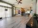 Spacious living room with hardwood floors and large windows at 1424 Richmond Grand Ave, Orlando, FL 32820