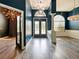 Living room with hardwood floors, two-toned walls and double doors at 1424 Richmond Grand Ave, Orlando, FL 32820