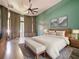 Main bedroom with light wood furniture, green walls and sliding doors at 1424 Richmond Grand Ave, Orlando, FL 32820