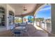 Covered patio area with tables and chairs overlooking the pool and playground at 1424 Richmond Grand Ave, Orlando, FL 32820