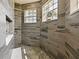 Walk-in shower with pebble floor and multiple shower heads at 1424 Richmond Grand Ave, Orlando, FL 32820