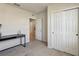 Well-lit bedroom with closet space, desk and neutral-toned walls at 1656 Aspen Ave, Davenport, FL 33837