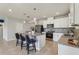 Bright kitchen with stainless steel appliances and granite countertops at 1656 Aspen Ave, Davenport, FL 33837