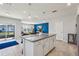 Kitchen island with granite countertops and seating at 1656 Aspen Ave, Davenport, FL 33837