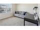 Home office with gray sofa and a desk at 1656 Aspen Ave, Davenport, FL 33837