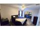 Bright bedroom with a double bed and mirrored closet at 1724 Silver Creek Ct # 105, Orlando, FL 32807