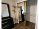 Mirrored closet with ample shelving and hanging space at 1724 Silver Creek Ct # 105, Orlando, FL 32807