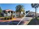 Community entrance with palm trees and signage at 1724 Silver Creek Ct # 105, Orlando, FL 32807
