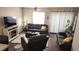 Living room with leather furniture and fireplace at 1724 Silver Creek Ct # 105, Orlando, FL 32807