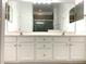 Double vanity bathroom with large mirror at 3929 Corrine Dr, Orlando, FL 32814
