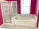 Bathroom features a shower, garden tub, and updated fixtures at 3929 Corrine Dr, Orlando, FL 32814