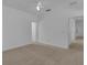 Spacious bedroom featuring neutral carpet and an open layout leading to other rooms at 3929 Corrine Dr, Orlando, FL 32814