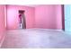 Pink bedroom with carpeted floors and ample space at 3929 Corrine Dr, Orlando, FL 32814