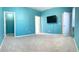 Blue bedroom with carpet and closet at 3929 Corrine Dr, Orlando, FL 32814