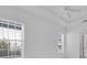 Bright bedroom with neutral walls, ceiling fan, and large window letting in natural light at 3929 Corrine Dr, Orlando, FL 32814