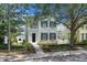 Two-story home with a covered balcony and beautiful landscaping at 3929 Corrine Dr, Orlando, FL 32814