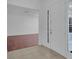 Bright, open foyer with tile flooring and view into the living room through an open entryway at 3929 Corrine Dr, Orlando, FL 32814