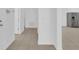 Tiled Hallway with access to kitchen with stainless steel refrigerator and multiple entryways at 3929 Corrine Dr, Orlando, FL 32814