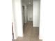 Simple hallway with tile flooring and access to bedrooms and bath at 3929 Corrine Dr, Orlando, FL 32814