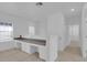 Bright hallway features built-in desk with white cabinets, creating a functional workspace in the home at 3929 Corrine Dr, Orlando, FL 32814
